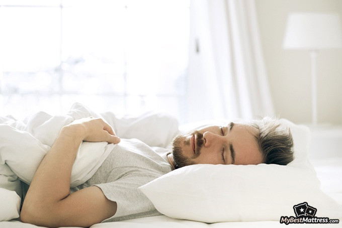 How to sleep on your back: a man sleeping on his back How to sleep on your back: a man sleeping on his back.